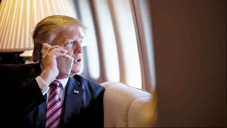 President Donald Trump talks on the phone aboard Air Force One during a flight to Philadelphia, Pennsylvania, to address a t gathering of House and Senate Republicans, Thursday, January 26, 2017. This was the President...s first Trip aboard Air Force One. (Official White House Photo by Shealah Craighead)